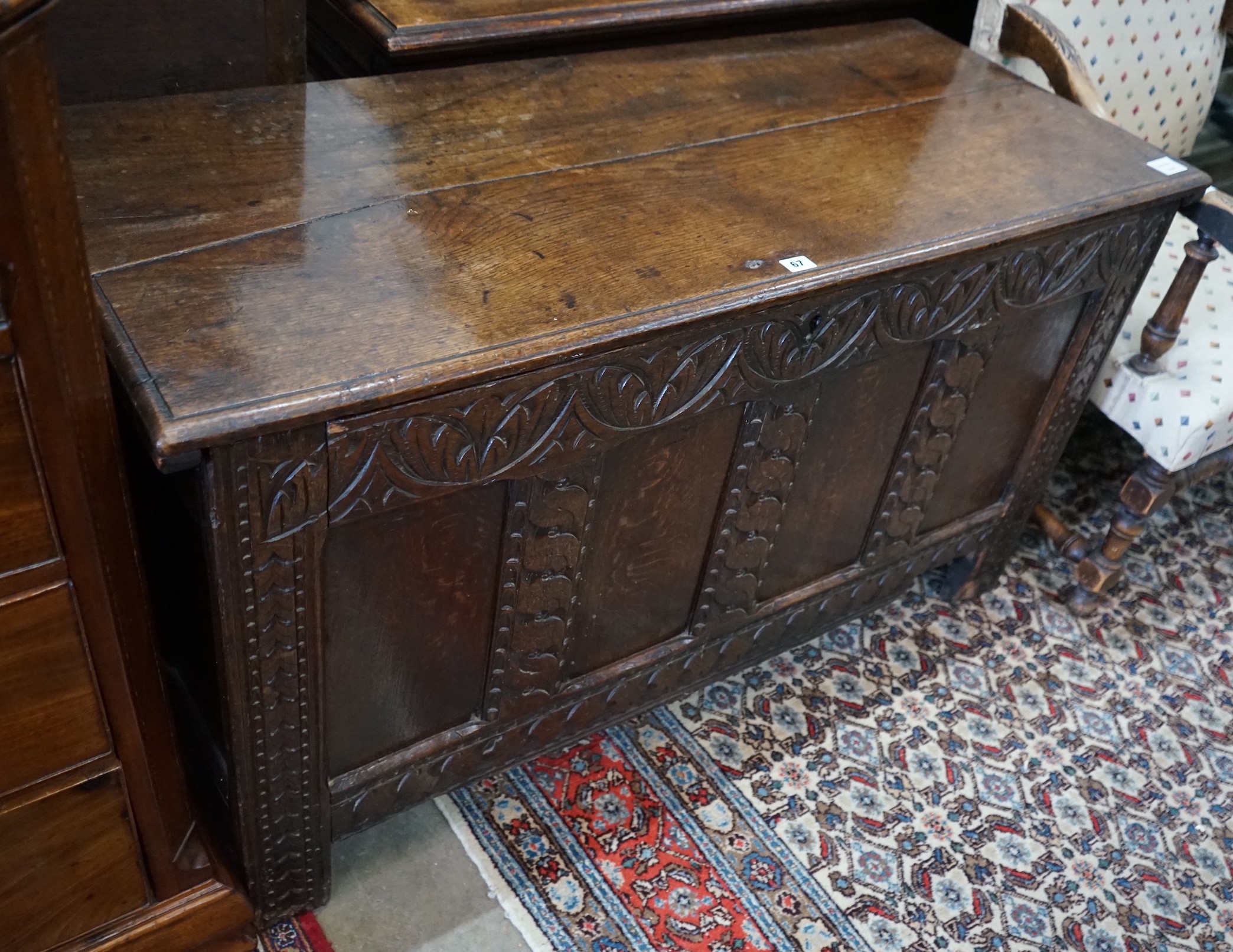 A late 17th / early 18th century carved oak coffer, length 127cm, depth 52cm, height 73cm